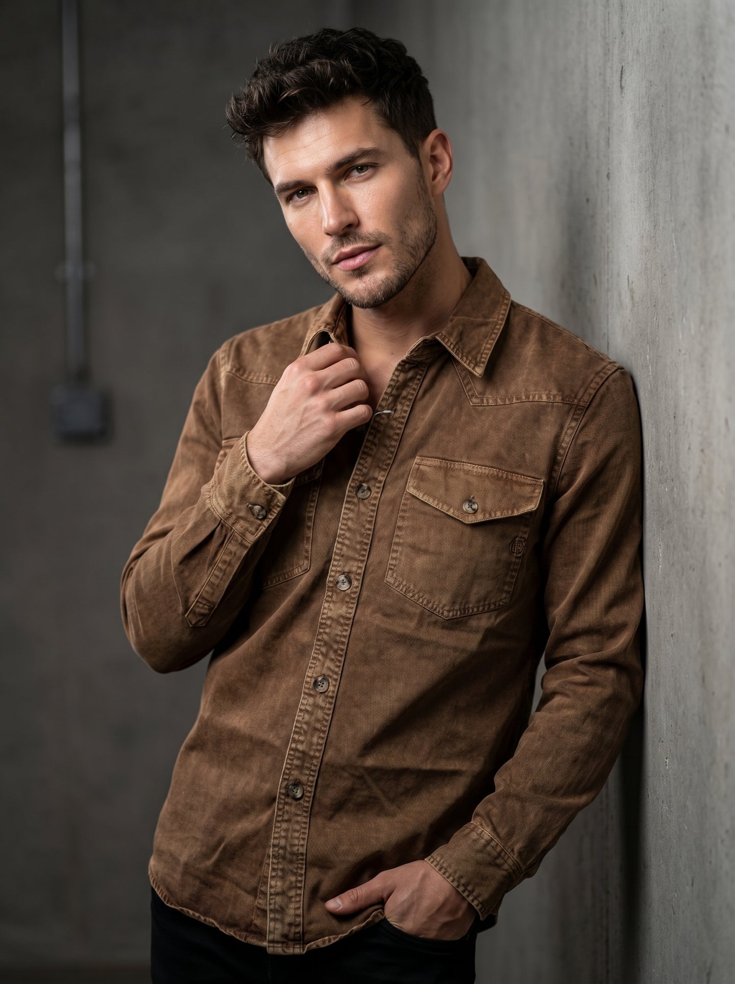 Brown denim western shirt with pointed collar, snap placket, and chest flap pocket.