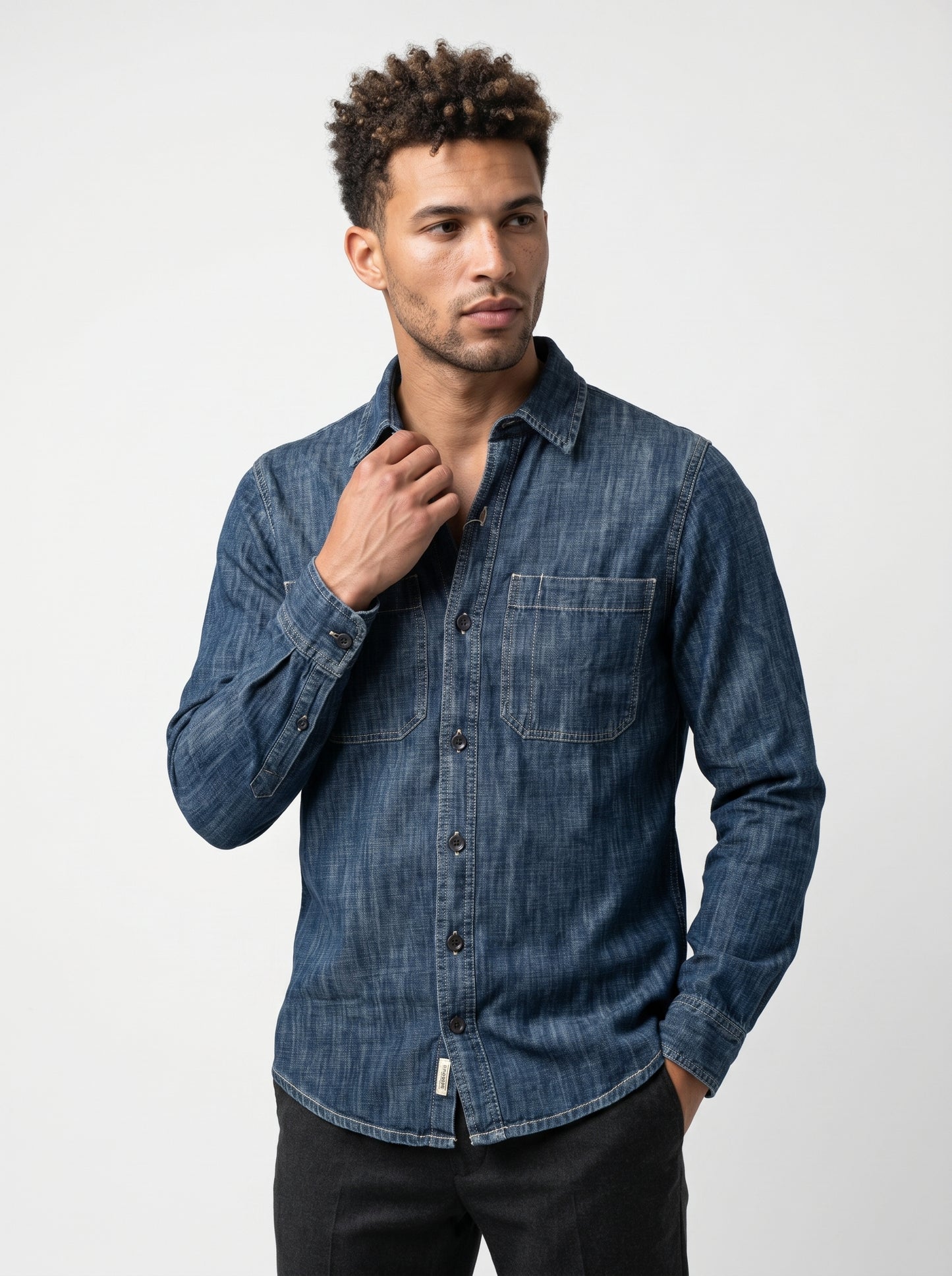 Indigo stonewash long-sleeve denim shirt with two chest pockets and button front