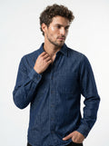 Indigo stonewash long-sleeve denim shirt with two chest pockets and button front