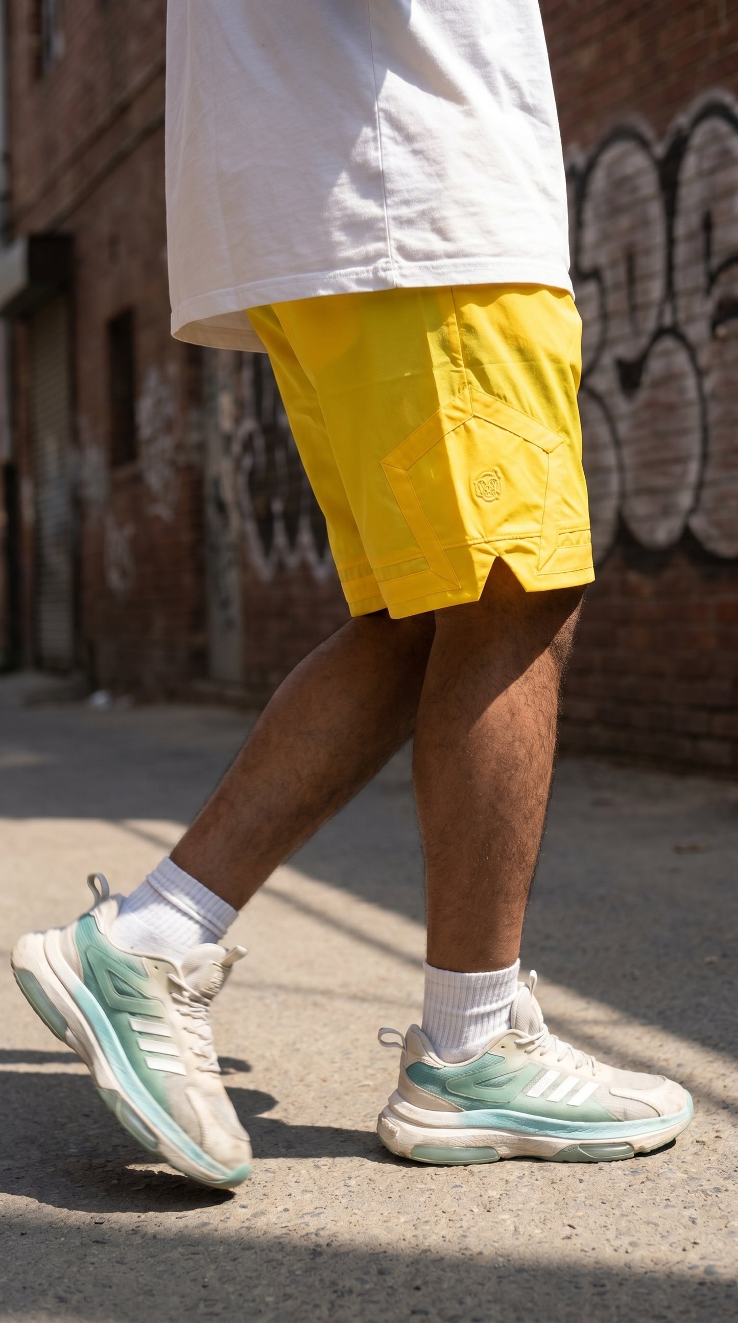 Yellow cargo shorts, side flap pocket and stitched seams