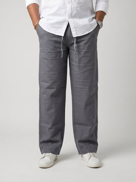 Relaxed slate grey drawstring trousers, straight roomy legs and cuffed hems