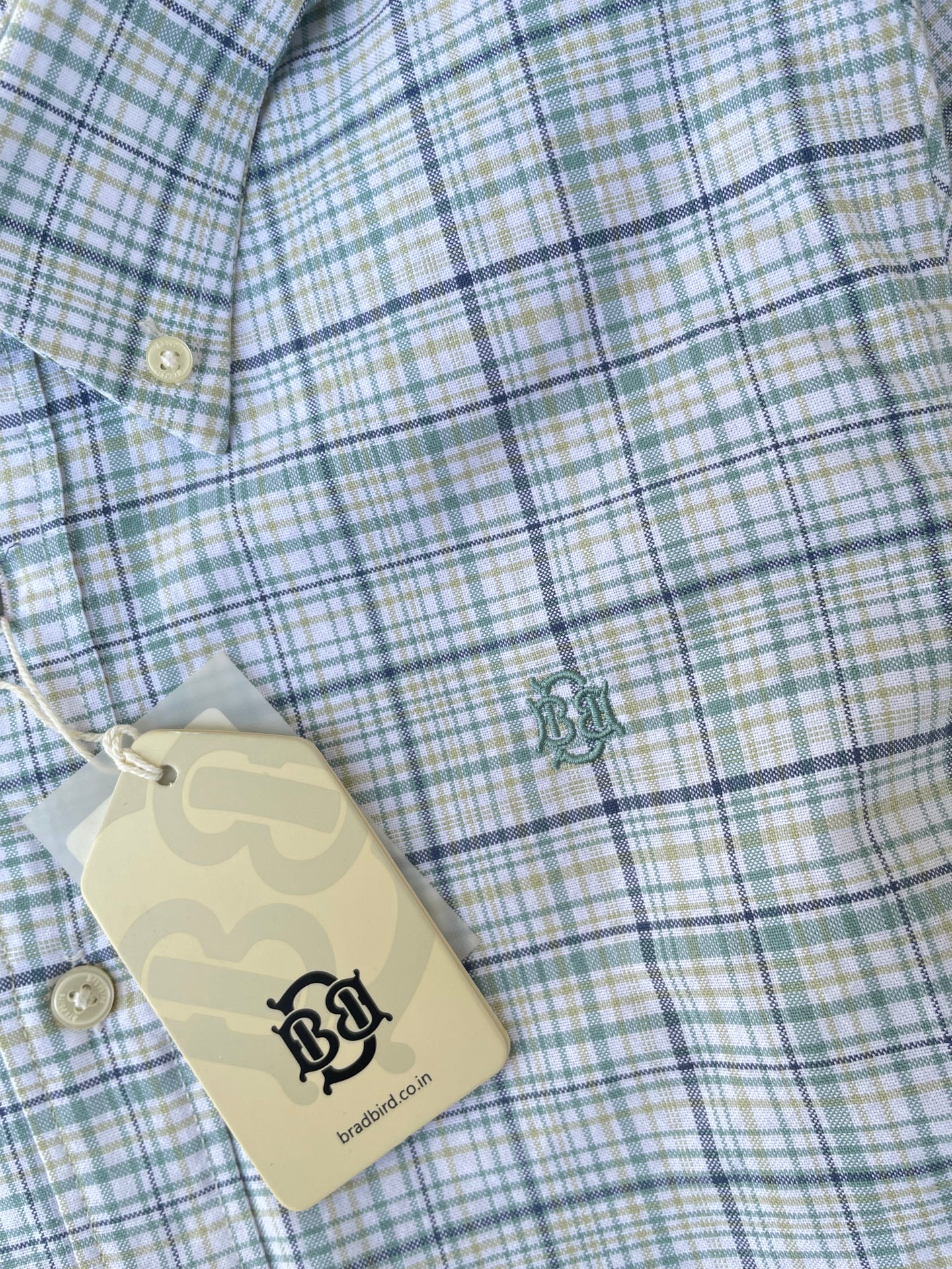 Green-blue and green plaid oxford check shirt close-up with hang tag