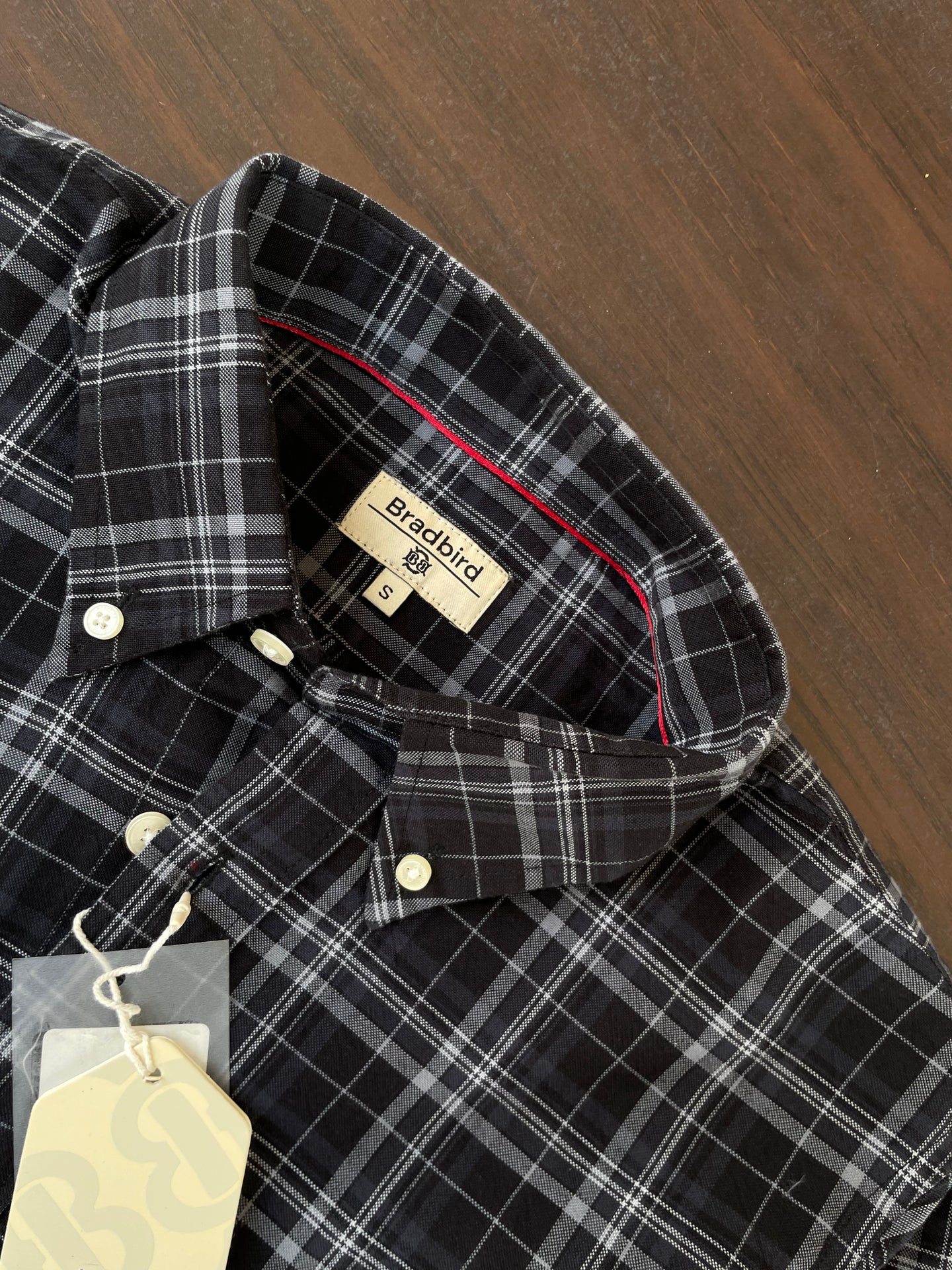 Black-and-white check shirt inside collar label and button placket