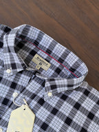 Black-and-white check shirt collar with button placket and inner neckline label