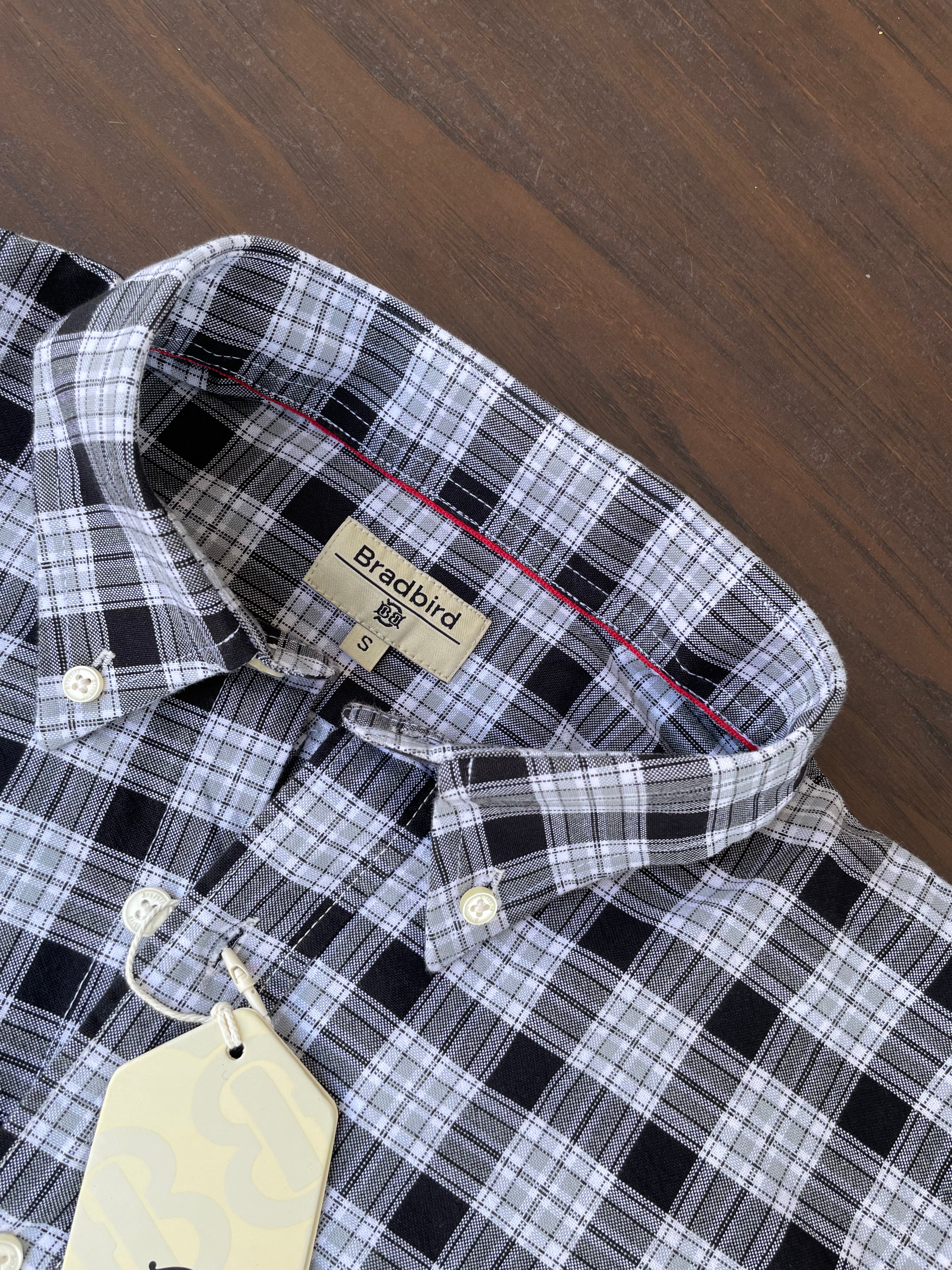 Black-and-white check shirt collar with button placket and inner neckline label