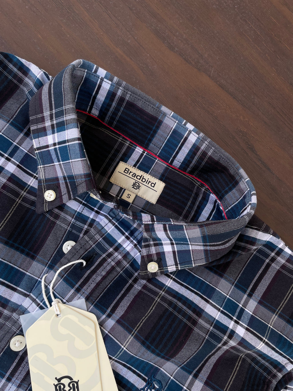 Navy blue, white, and light-blue check shirt collar with size label on placket