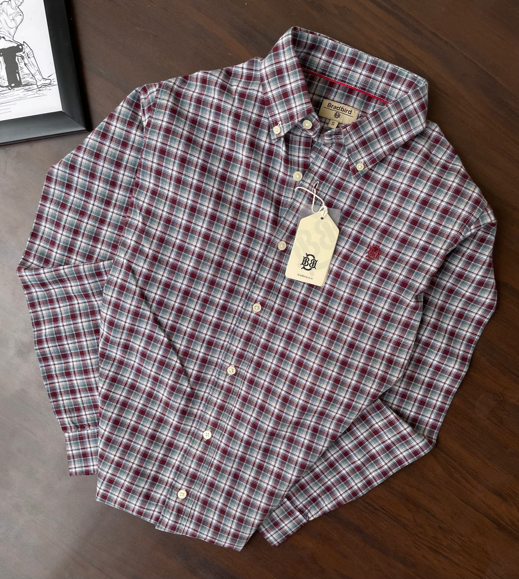 Red and green plaid oxford button-up shirt with button placket and collar