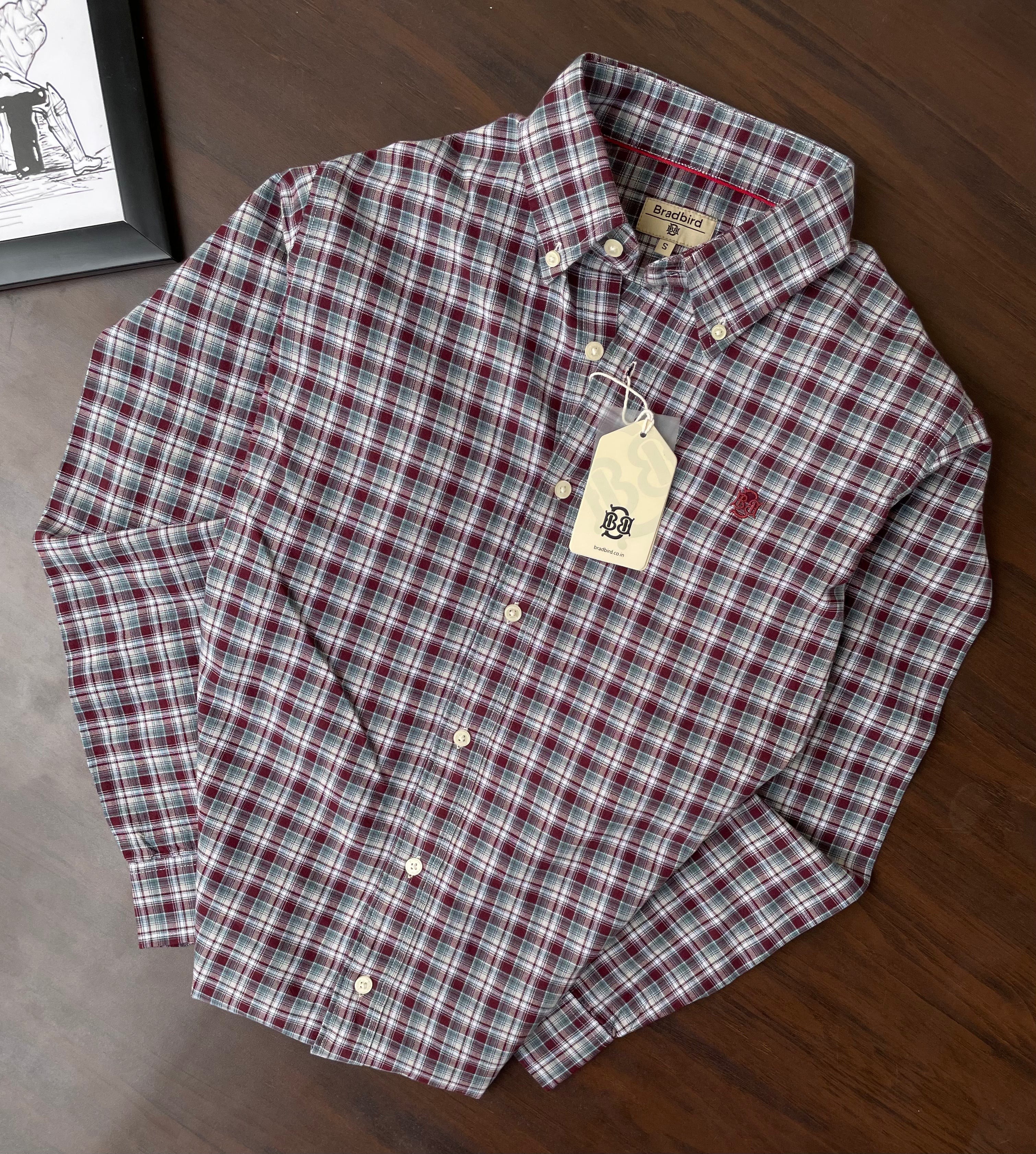 Red and green plaid oxford button-up shirt with button placket and collar
