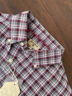 Plaid oxford shirt close-up: buttoned collar and inner neckline label