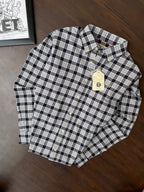 Black-and-beige plaid men’s Oxford shirt on hanger, button front, long sleeves