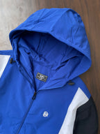 Blue hooded windbreaker hood interior with front zipper and chest logo