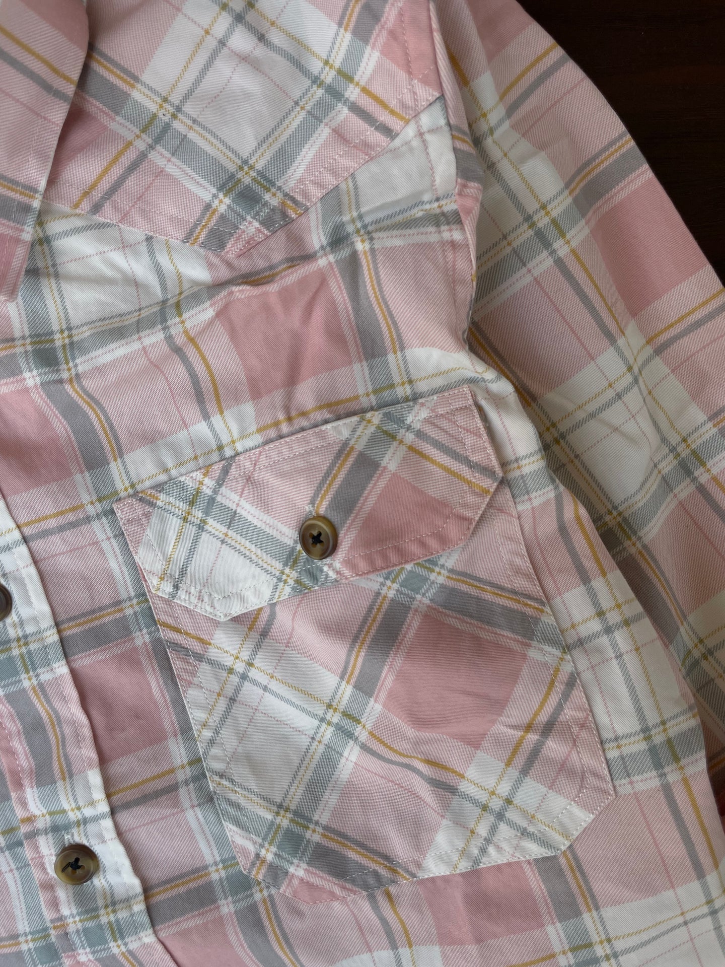 Dusty pink plaid western shirt chest pockets with buttoned flap detail