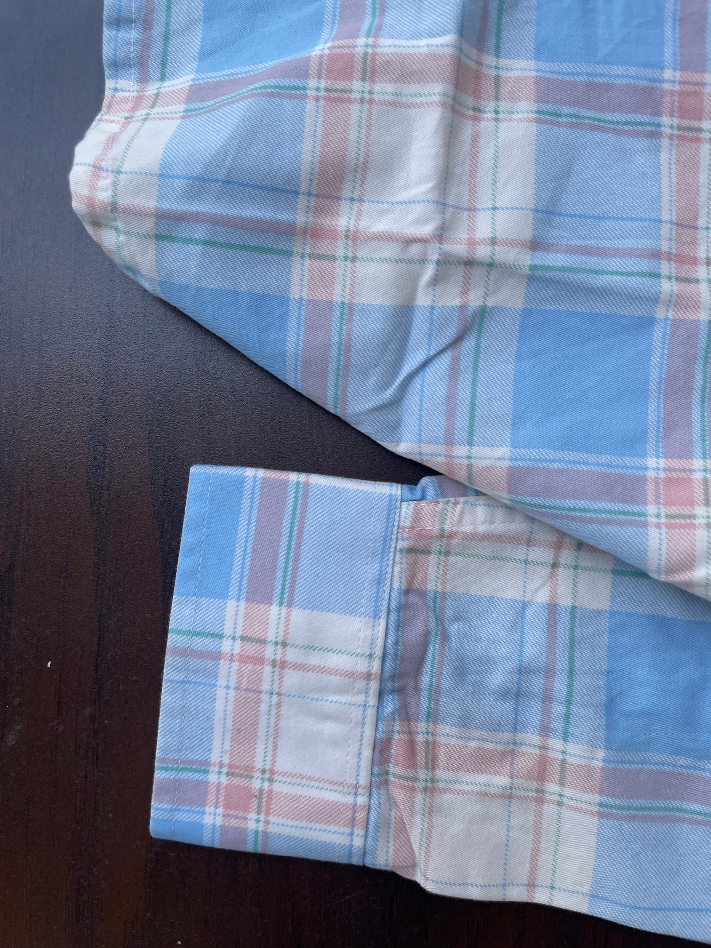 Sky blue plaid shirt cuff and sleeve hem with stitched edge