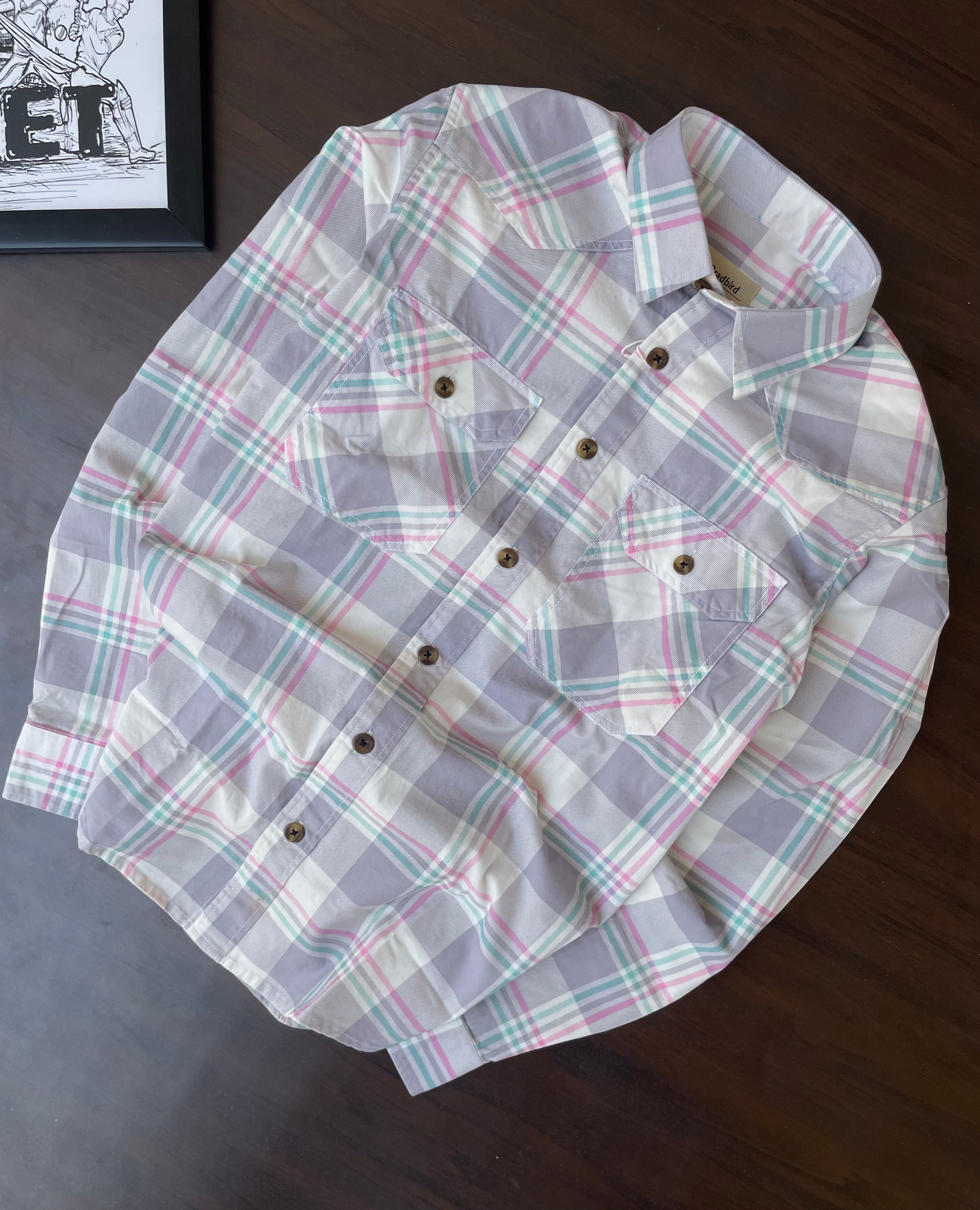 Lavender-grey plaid western shirt with pointed yokes and two chest pockets, flat lay