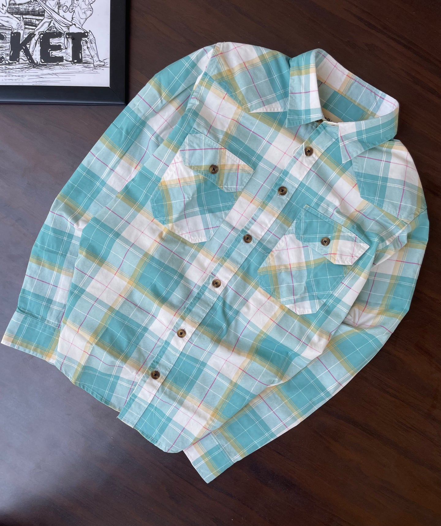 Folded aqua turquoise plaid western shirt, snap-button front and yoke