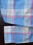 Sleeve cuff and hem on sky blue plaid western shirt with candy pink and white