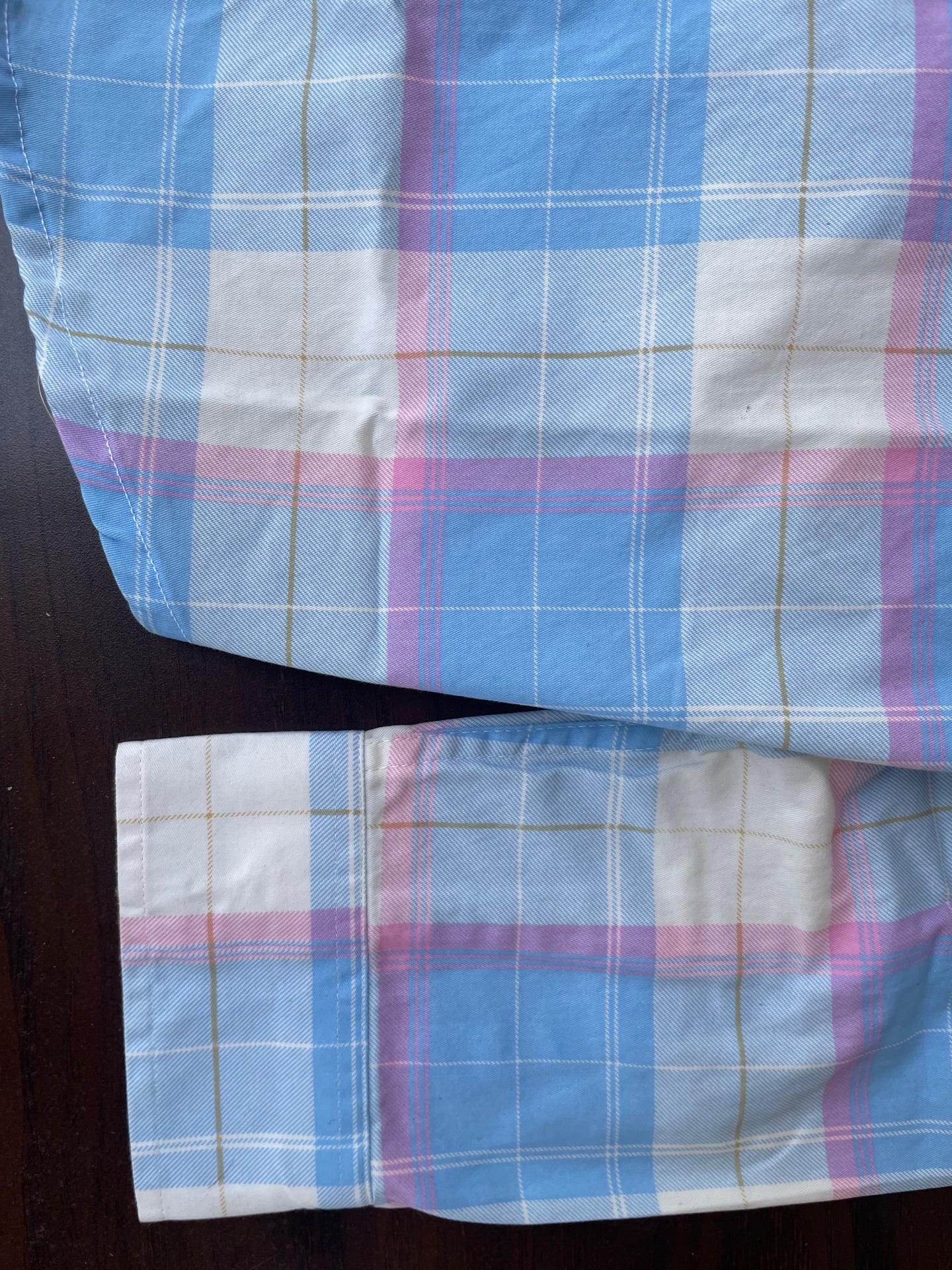 Sleeve cuff and hem on sky blue plaid western shirt with candy pink and white