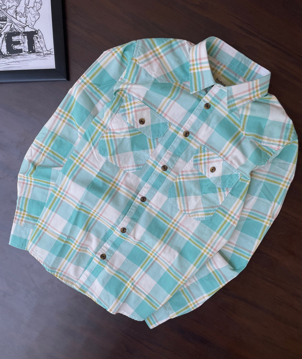 Seafoam plaid western shirt folded flat; collar, pointed yoke, and chest pockets
