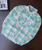 Seafoam plaid western shirt folded flat; collar, pointed yoke, and chest pockets
