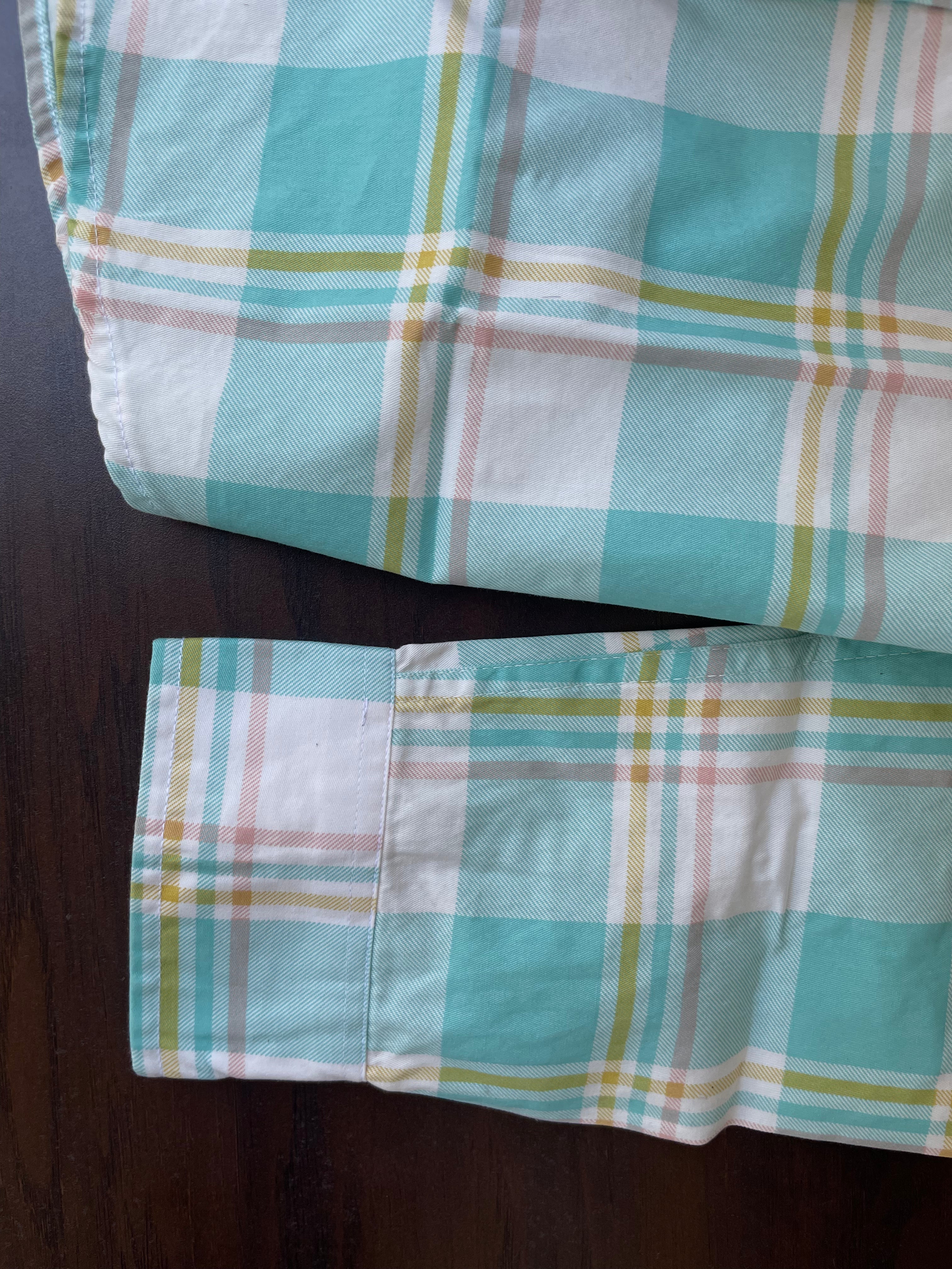 Mint seafoam plaid shirt hem and sleeve cuff; contrast seam stitching