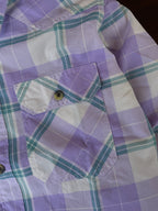 Purple and teal plaid western shirt chest pocket flap with button detail