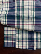 Green and navy plaid cotton shirt, folded cuff and hem detail