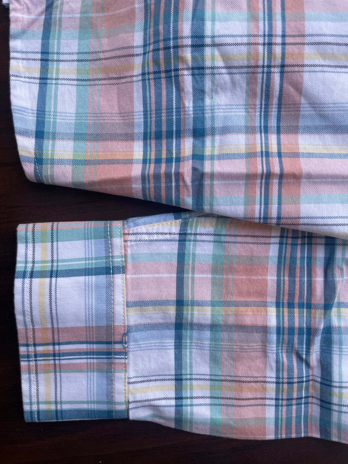 Pastel plaid long-sleeve cotton shirt cuff and hem, folded