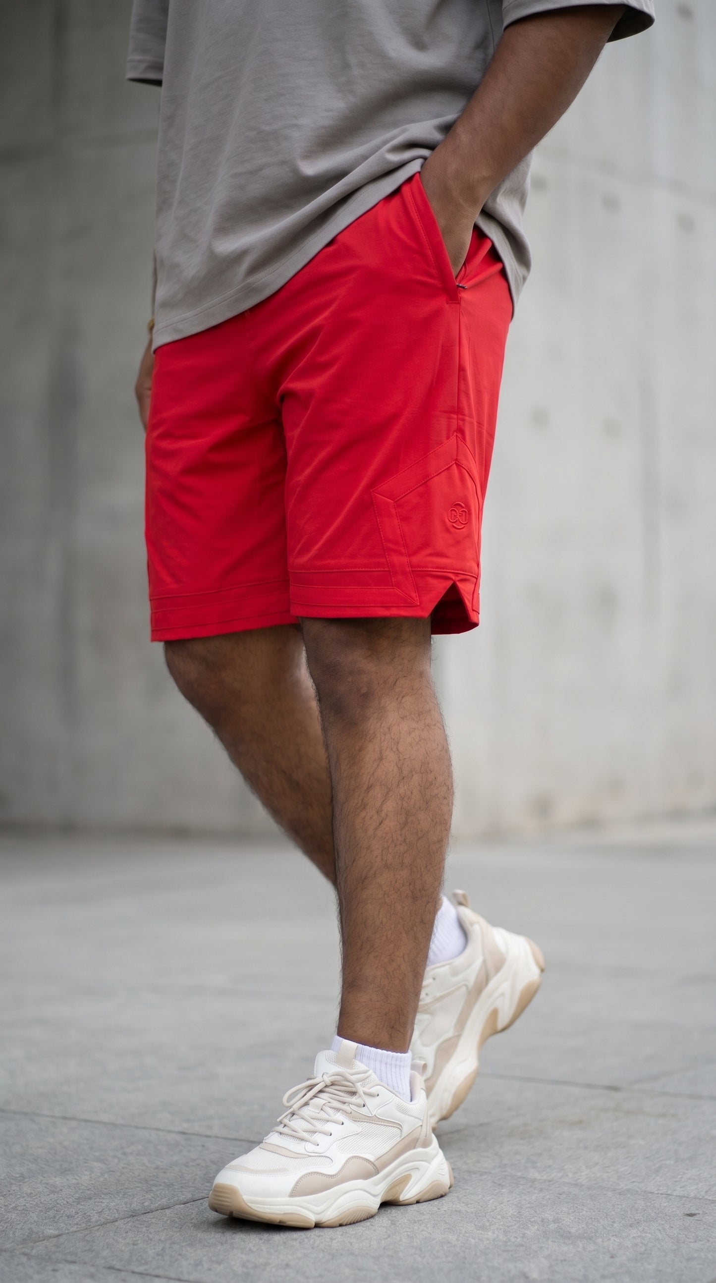 Red streetwear shorts with pentagonal back pocket and drawstring waist