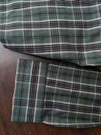 Bottle green tartan check shirt hem and cuff, with button detail