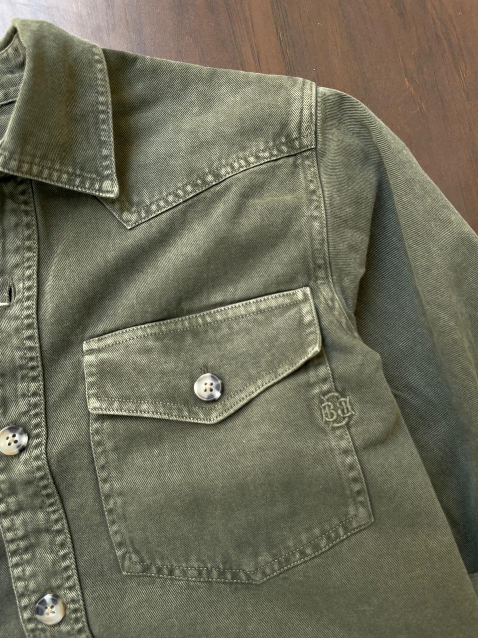 Olive denim shirt chest pocket with snap button and stitched panel detail