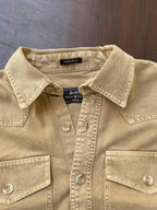 Tan beige denim western shirt close-up of collar, button placket, and chest pocket flaps