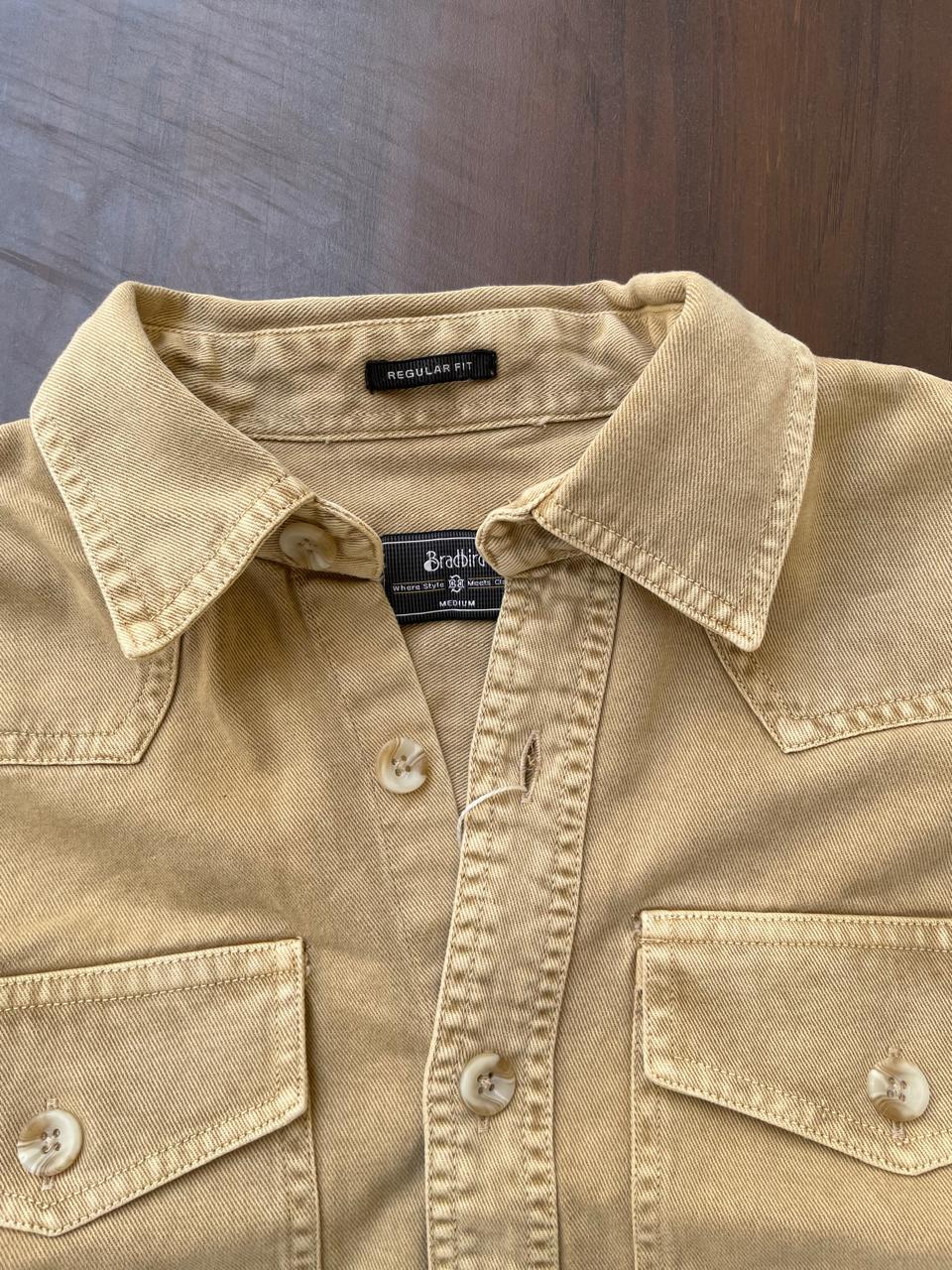 Tan beige denim western shirt close-up of collar, button placket, and chest pocket flaps