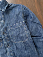 Stonewash indigo denim shirt side pocket with contrast topstitching and button detail