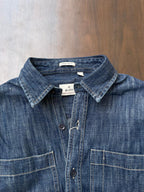 Stonewash indigo denim shirt close-up with collared neck and button front