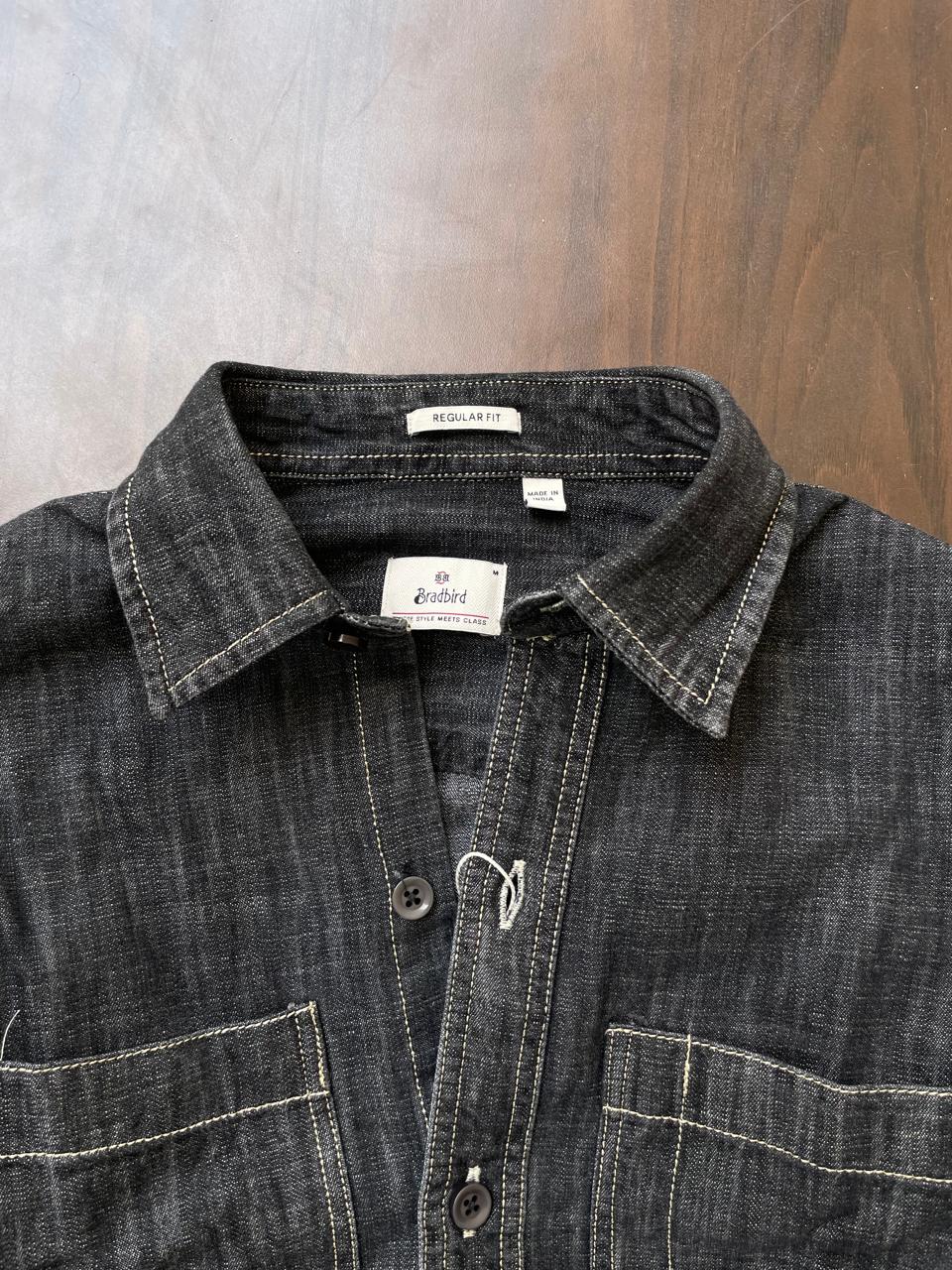 Dark slub denim shirt collar and button placket, with inner label details