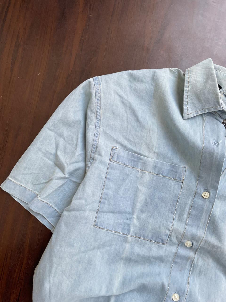 Mint light-wash denim half-sleeve button-up shirt, close-up of chest pocket