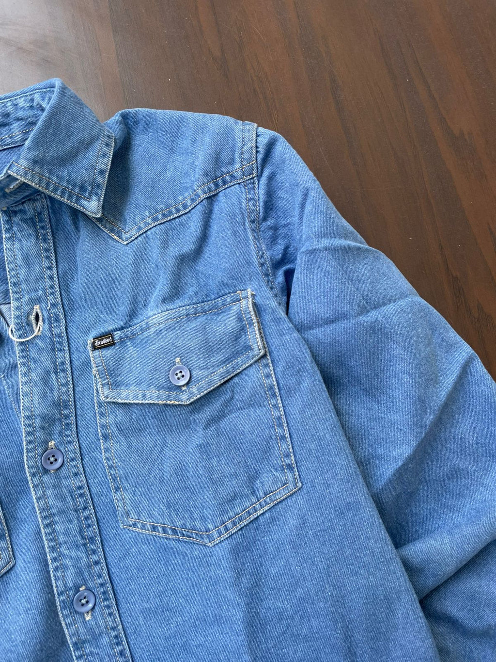 Medium-wash denim western shirt with pointed yoke and front button placket