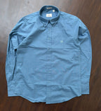 Indigo-blue oxford button-up shirt with button-down collar and chest monogram.