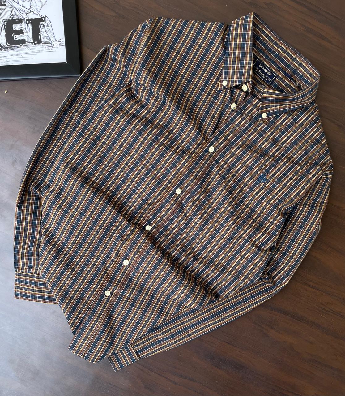 Mustard & navy plaid button-up shirt with collar and white buttons