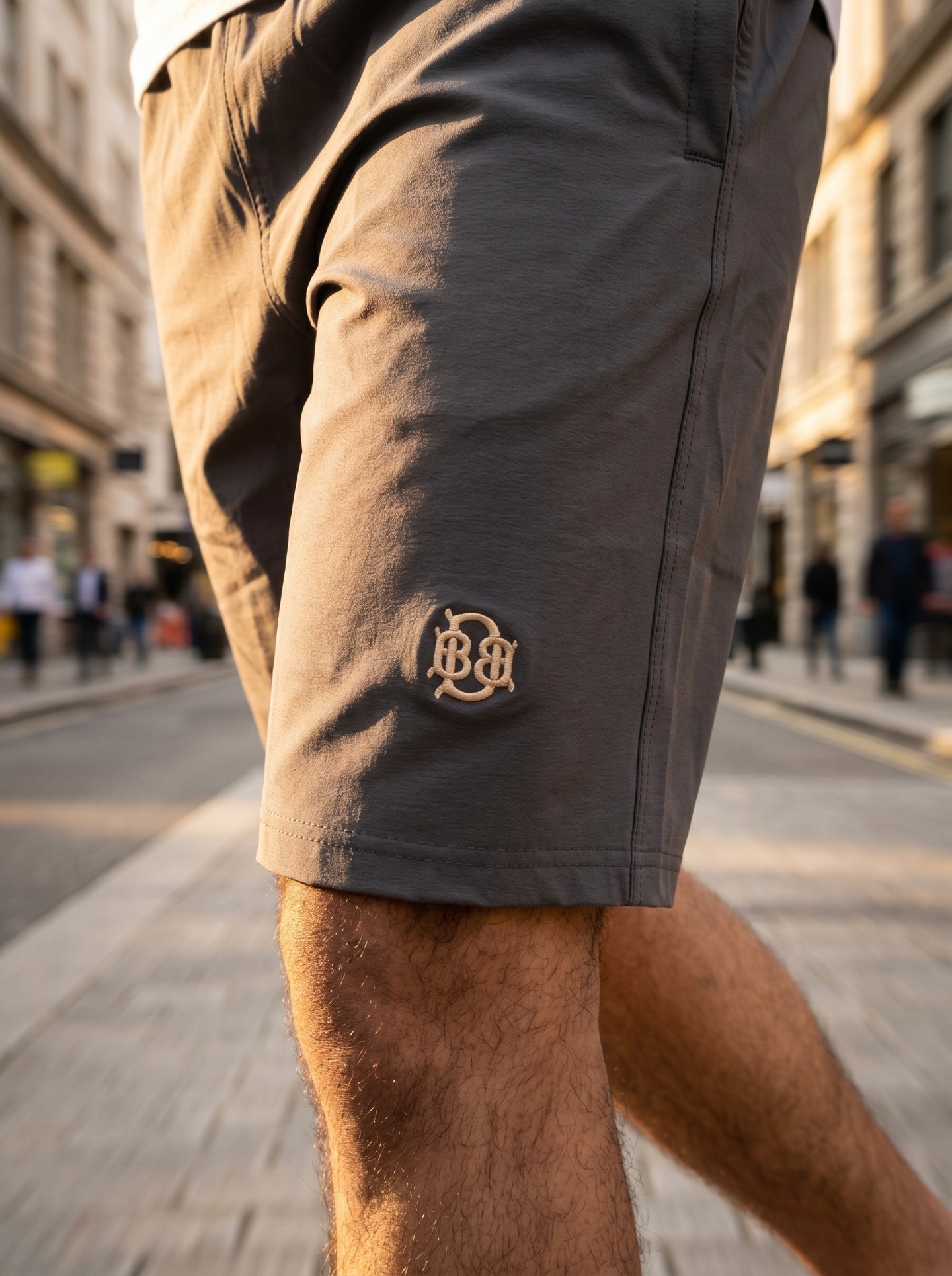 Dark grey tech shorts with stitched hem and small BB logo on the side